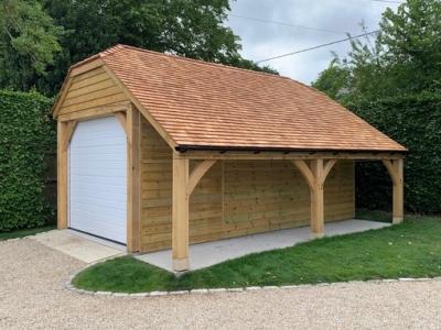 Pic 54. 6.0m x 3.0m 1 bay Carriage House with 6.0m x 1.2m Log Store under cat slide, cedar shingle roof
